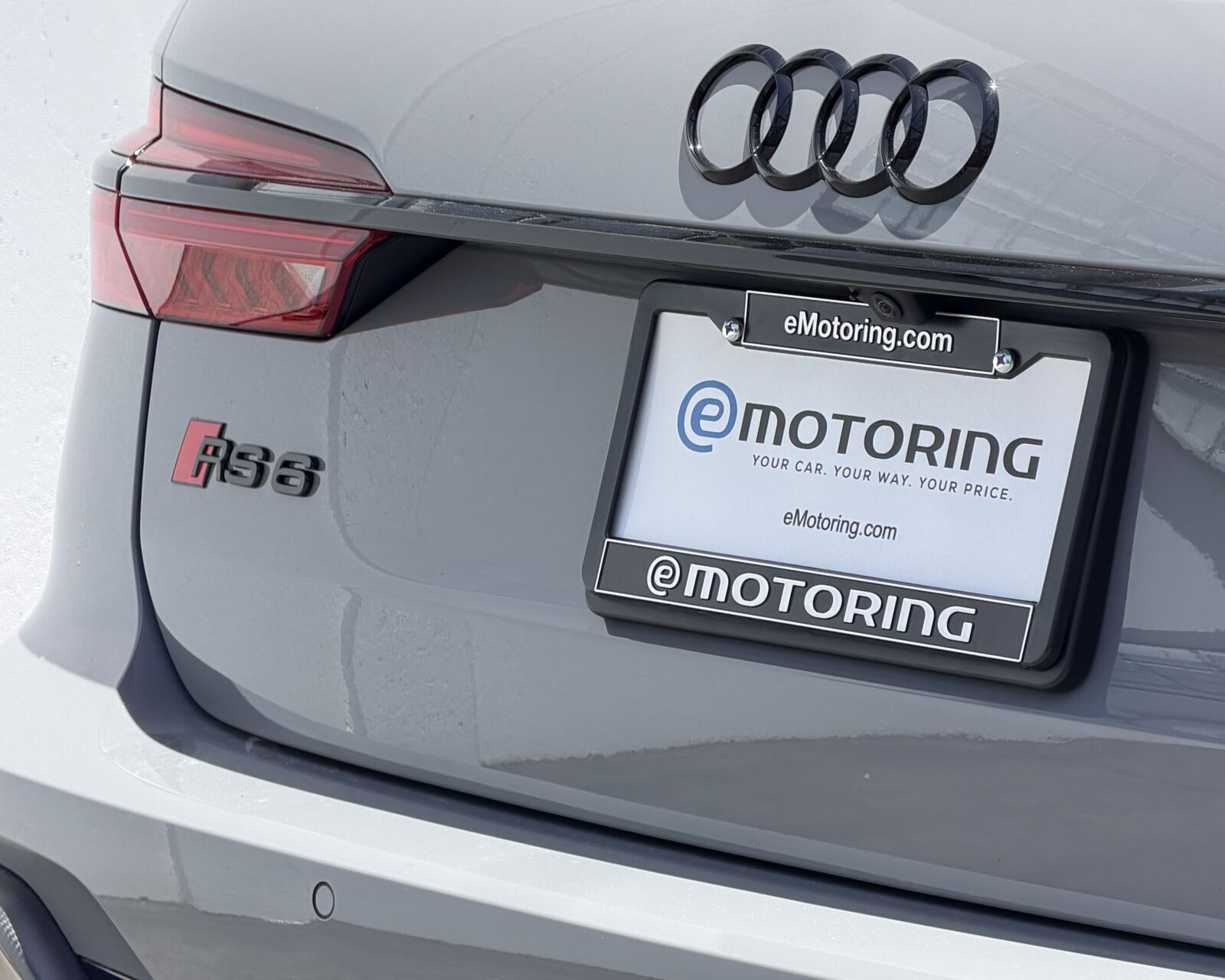 A Nardo grey Audi RS6 with an eMotoring plate frame